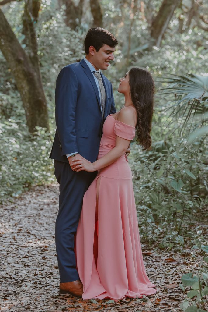 A beautiful couple, posing in the forest for wedding photos