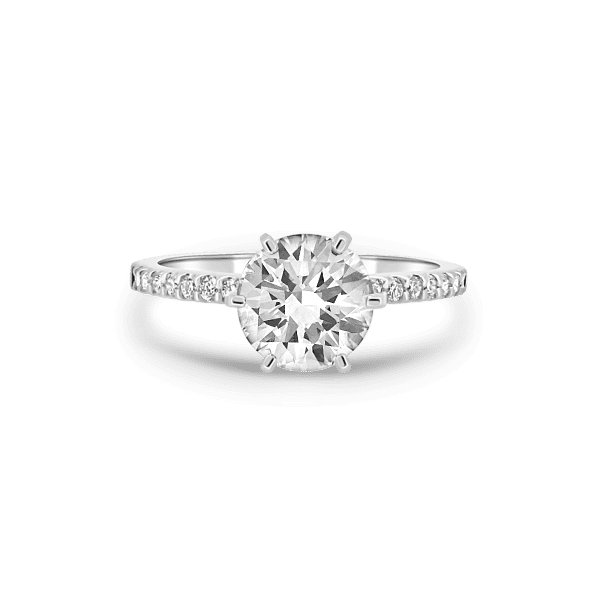 Engagement Ring with large Center Diamond and smaller Diamonds on the band.