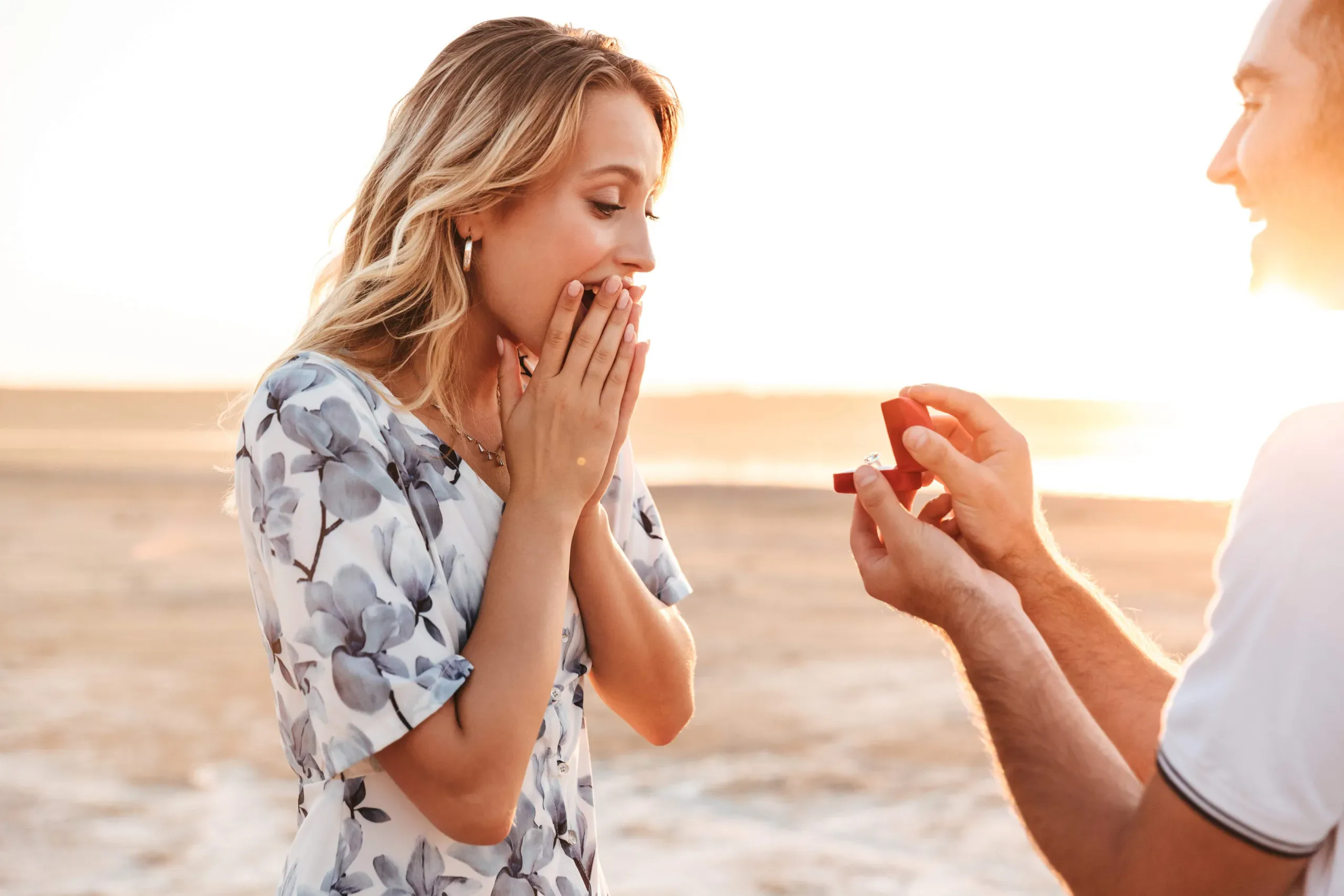 Happy couple getting engaged with a beautiful ring in Miami